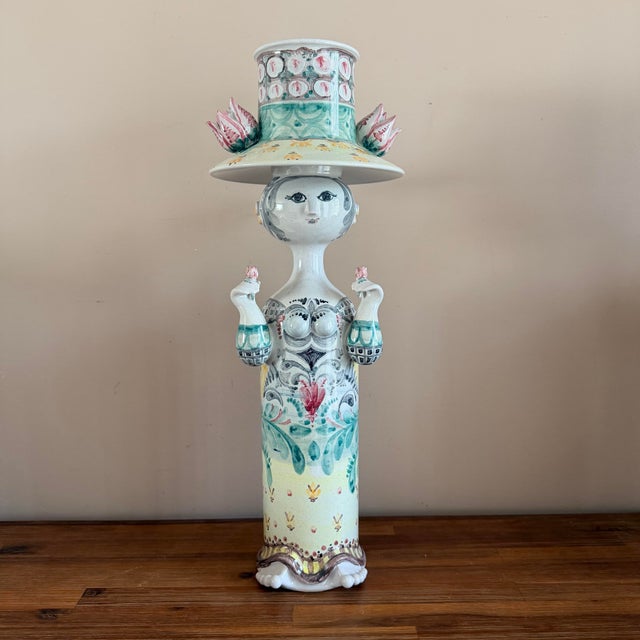 A wonderful large pair of Bjorn Wiinblad ceramic figural candlesticks with removable inserts, full of the whimsical detail...