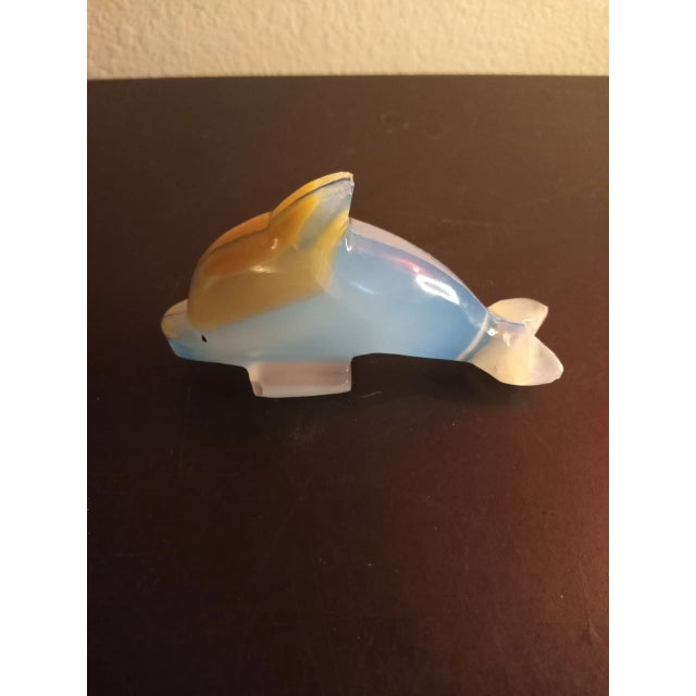 This is a Solid Onyx Blue 5" Dolphin Sculpture Procured at auction
