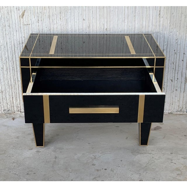 About New pair of mirrored nightstands in black mirror and chrome. Beautiful pair of nightstands with mirrored finished...