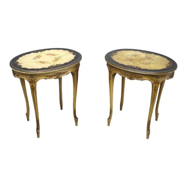 A distinguished pair of antique French-style oval side tables, by Imperial of Grand Rapids, dating to approximately 1930....