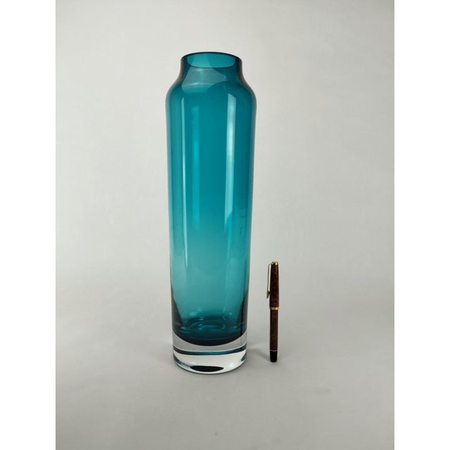 Exceptionally large aquamarine crystal glass vase with a solid clear glass base in Scandinavian style, circa 1960.
