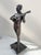 "harlequin playing the guitar" by debut marcel bronze group with brown patina signed on the base marcel debut born in...