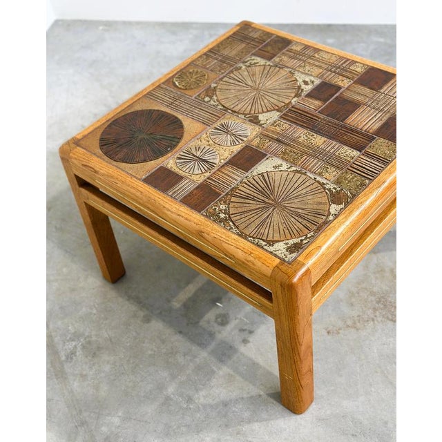 A striking danish modern coffee table designed by tue poulsen for haslev møbelsnedkeri, denmark, dating from the...