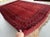 A striking vintage Afghan Ersari "Gülli Gol" tribal rug — hundreds of small rounded quatrefoil flower-guls fill the deep...