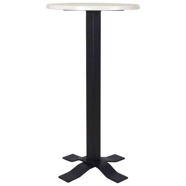 Bistro high table in wrought iron with marble top.