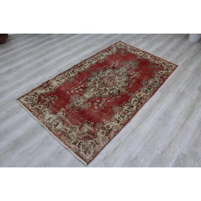 This gorgeous hand knotted Vintage Anatolian area rug is approximately 60 years old in excellent vintage condition. The...