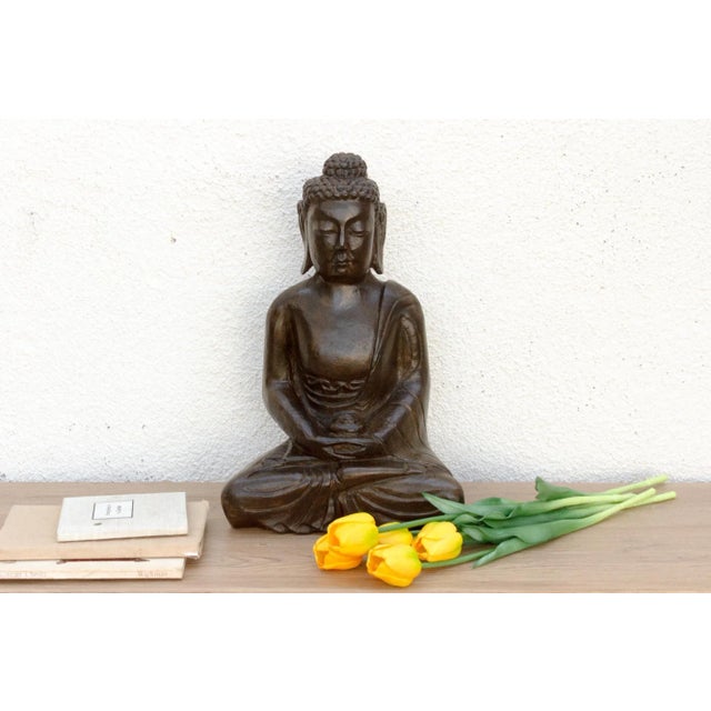 Introduce a profound sense of peace and spiritual artistry to your space with this magnificent hand-carved stone Buddha....