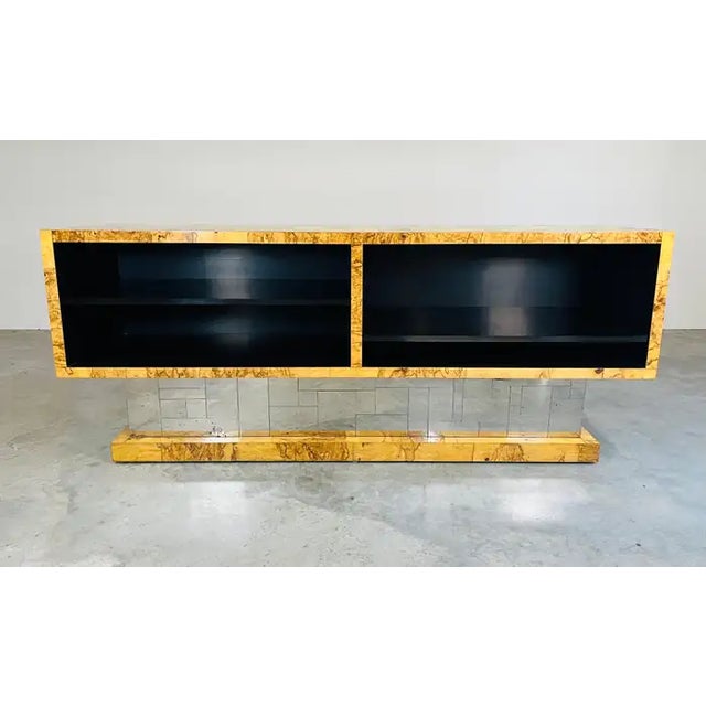 A stunning and exceptionally rare console bar cabinet in Olive Burlwood and patchwork chromed steel designed by Paul Evans...