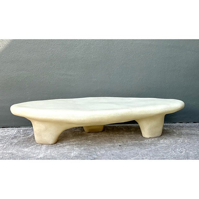 This stunning biomorphic coffee table is a masterpiece of organic modernism, featuring a sculptural, fluid silhouette that...