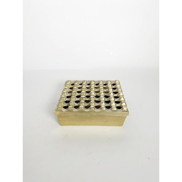 “Ultima” ashtray designed by Beck & Jung in Denmark during the 1960s. Crafted in solid brass, the piece features a...