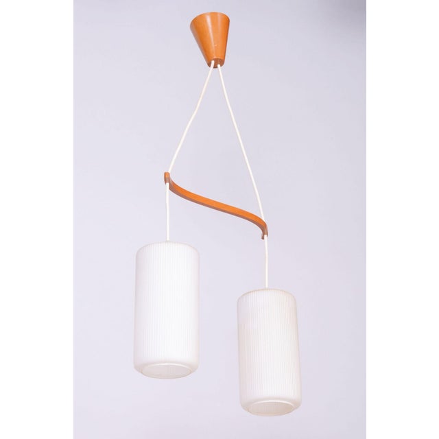 This two-arm chandelier, produced by the dřevo humpolec factory, is an iconic representative of czechoslovak design from...