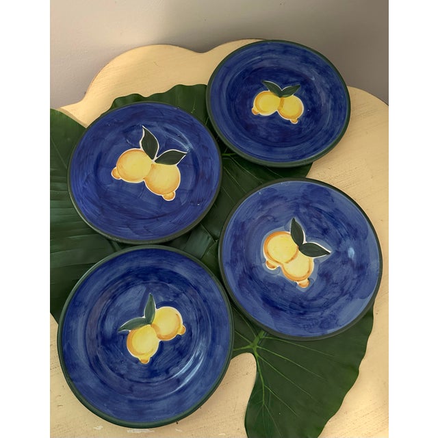 Beautiful set of 4 vintage Italian hand painted lemons plates, with a blue background and green border and two yellow...