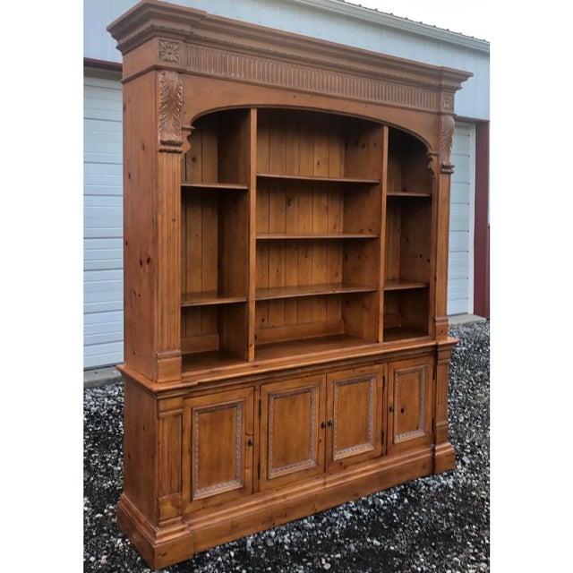 Impressive and regal arched bookcase by Ethan Allen from the Townhouse Collection. Crafted in solid pine. Beautifully...