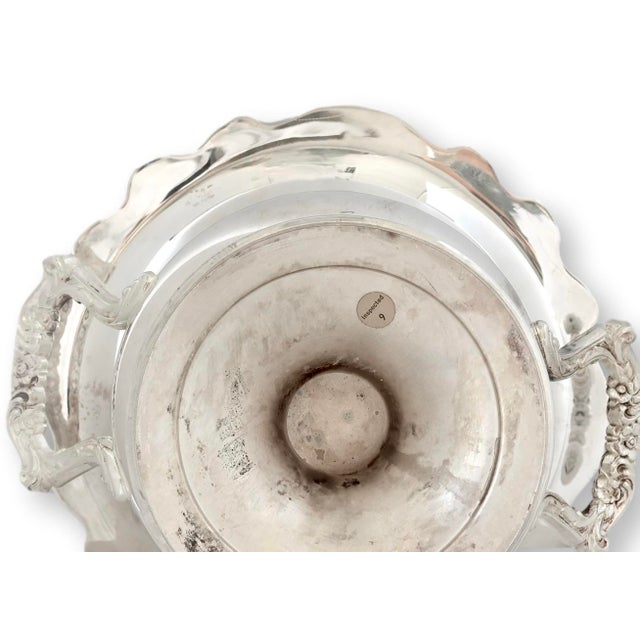 Mid-20th-century English silverplate champagne or wine cooler with flared rim, decorative handles, and original removable...