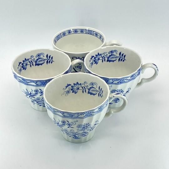 Charming lot of four vintage English teacups referencing the iconic Blue Onion pattern. The listing contains three “Blue...