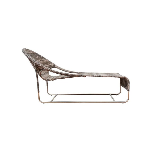 Woven chaise with hooped back and open sides updated for the outdoors. Available in natural, white-colored or in blue-...