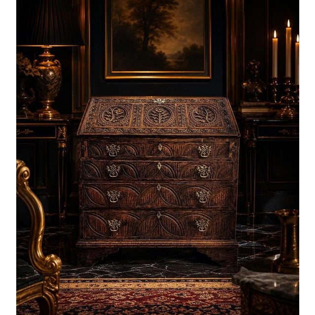 A magnificent 18th-century carved oak bureau, dating to circa 1760–1800, displaying exceptional craftsmanship, extensive...