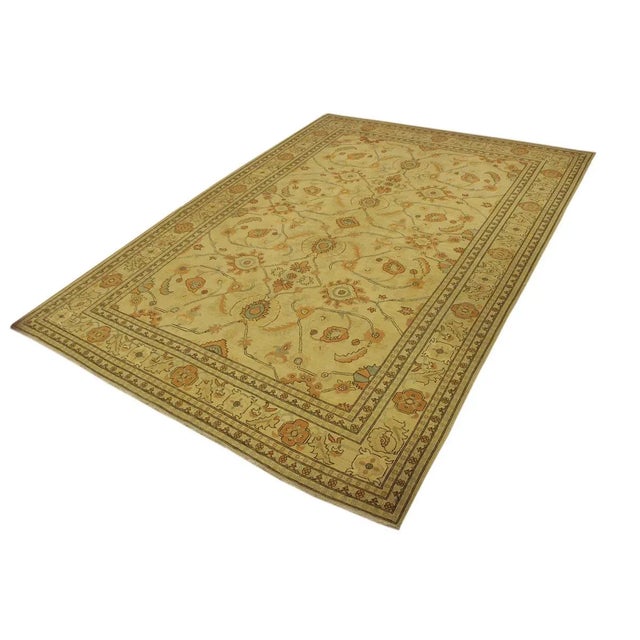 A Persian influenced Turkish hand knotted rug made by skilled artisans capable of creating the most exceptional vegetable...