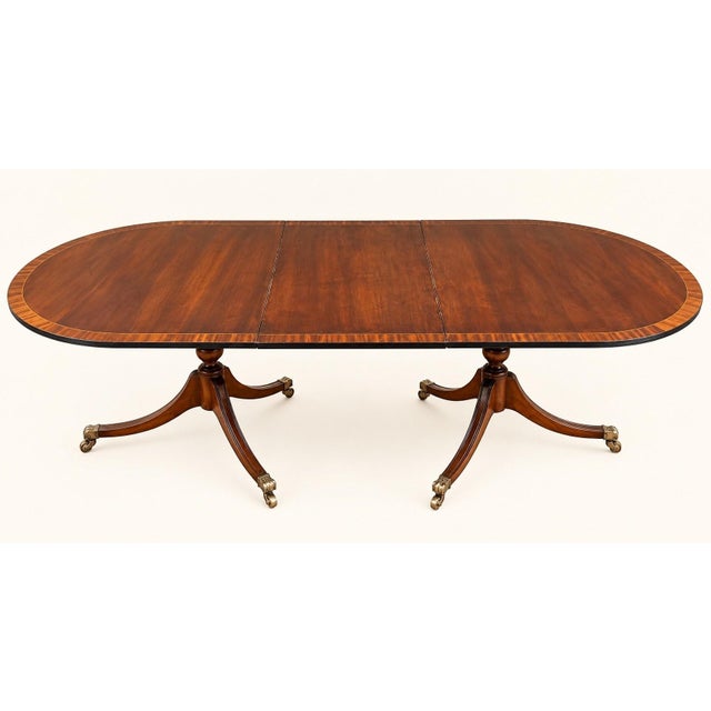 Large Extendable English Mahogany Regency Style Table with Brass Claw Legs, 1890s, in Very Good conditions. Designed 1890...