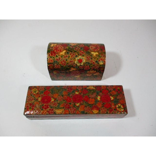 Set of 2 Kashmir handmade and intricately painted, papier mache' lacquer boxes They have overall floral patterns, in...