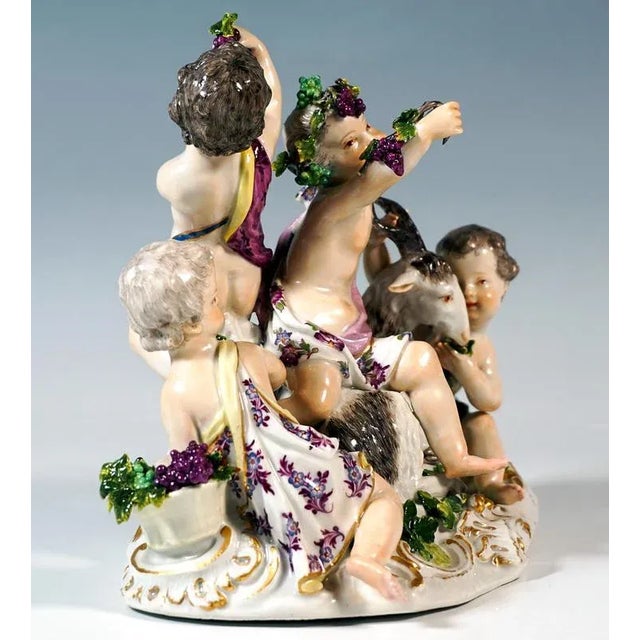 Excellent piece of meissen porcelain of the 18th century: four cupids in cloths grouped together with a billy goat lying...