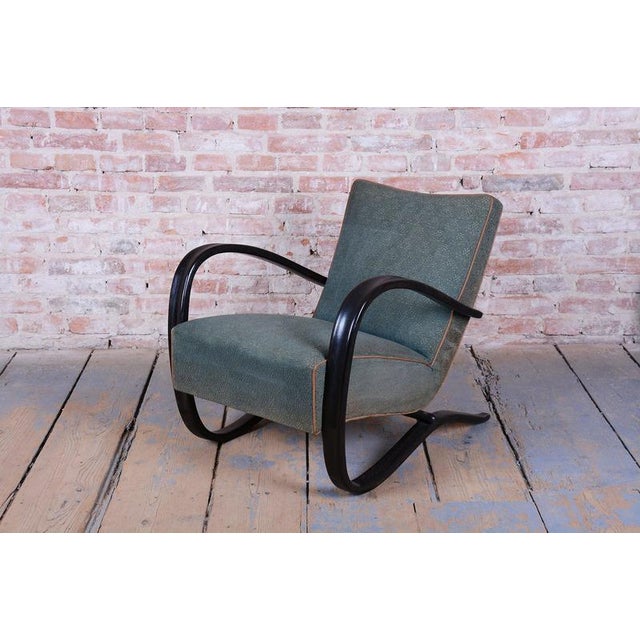 Model: h-269 conceived in the spirit of interwar art deco, this exceptionally iconic and dynamically shaped armchair...