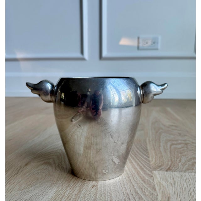 A rare and wonderfully sculptural silver-plated ice bucket by Escapade Paris, dating to the 1970s. Its streamlined, highly...