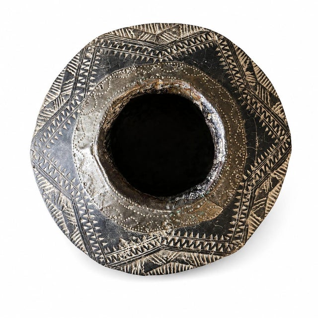 A culturally-significant antique Bedouin coffee mortar and pestle traditionally called a mihbaj or mehbash. This hand-...