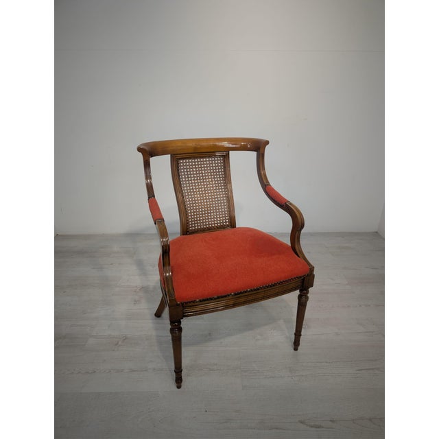 Biedermeier-style armchair from the 1950s with a raffia backrest and a red upholstered seat. The wooden frame features...