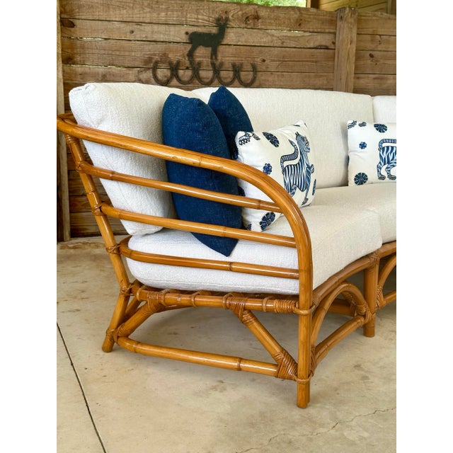 Freshly restored and thoughtfully updated, this exceptional mid-20th century modular rattan sectional offers timeless...