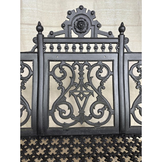 A beautifully cast architectural garden bench in the John McLean style, featuring crisp tracery panels and pierced seat...