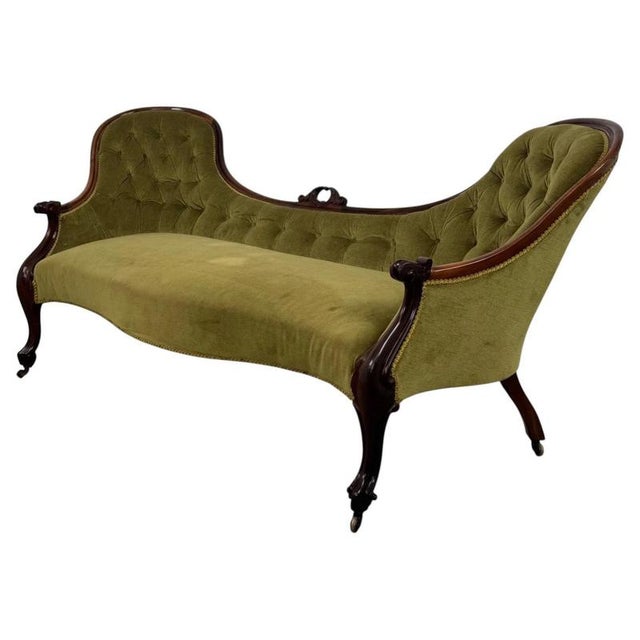 An impressive 19th-century English Victorian double spoon-back settee, finely crafted from mahogany and distinguished by...