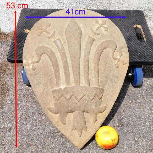Important coat of arms carved in high relief from natural stone, in the form of a medieval almond-shaped shield (drop-...