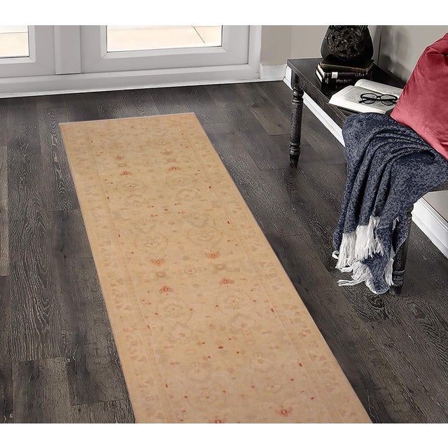Enhance the ambiance of your home with this magnificent Persian-influenced Turkish hand-knotted rug made by skilled...