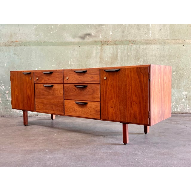 Vintage Jens Risom (attributed) 72” walnut credenza in beautiful condition. It features four standard drawers, one file...