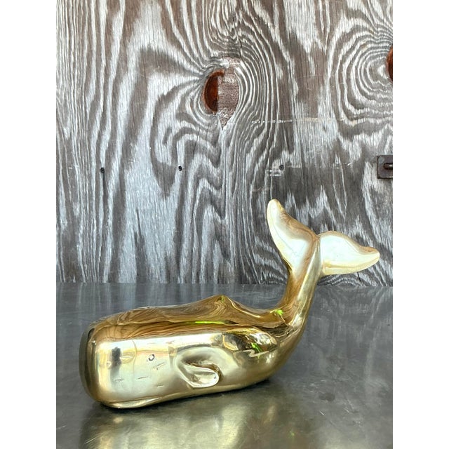 Dive into sophisticated charm with this magnificent vintage bohemian polished brass whale sculpture. Crafted from solid...