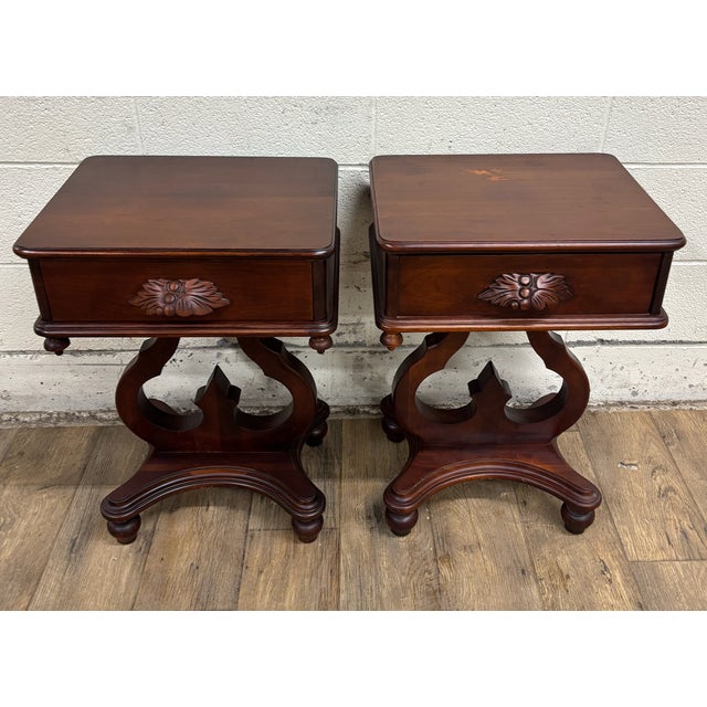 This is a gorgeous and rare pair of vintage lyre base nightstands, side tables, or end tables, believed to be cherry, and...