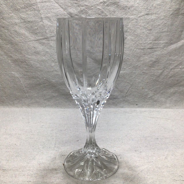 Set of eleven crystal Berkeley water goblets by Mikasa. Nicely weighted and easy to hold on to with their fluted stem.
