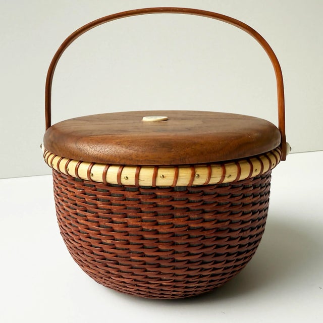 This beautifully handcrafted vintage Nantucket Lightship Basket is a signed piece, marked by the artisan on the underside....