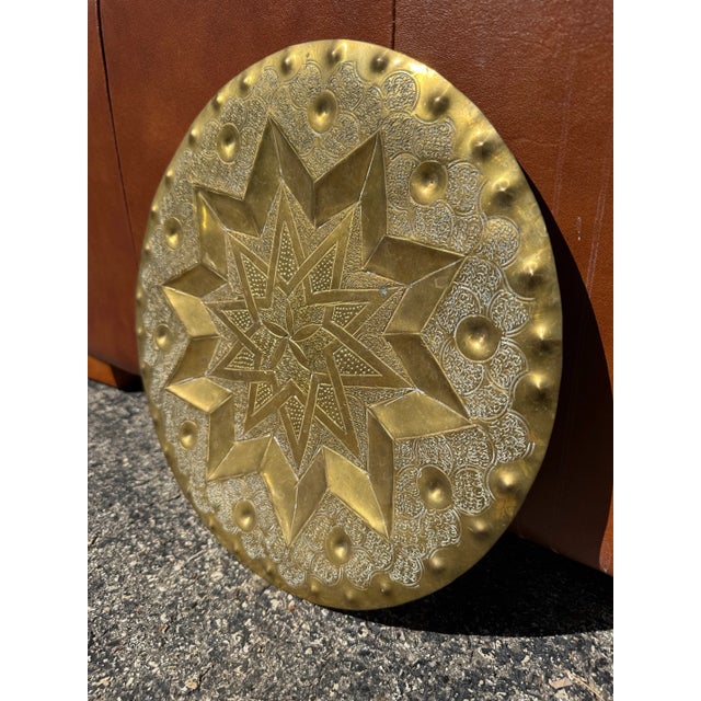 A nice sized textured brass platter / plate / tray designed to be used as a wall hanging. The medallion has a beautiful...