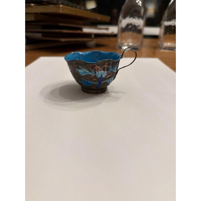 Antique Chinese Export Enameled Copper Miniature Tea Cup with Floral Design. This exquisite miniature features hand-...