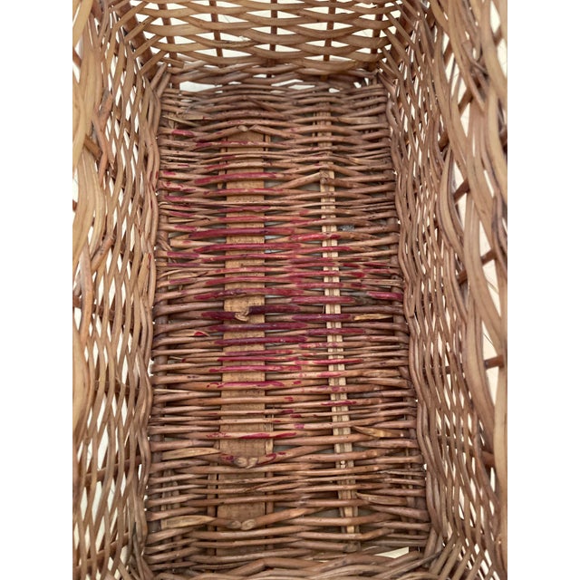 The vintage brown wicker basket is designed in the shape of a truck and is suitable for picnics or storage. It exudes a...