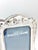 A beautifully detailed silver plate frame. It holds a 5x7 image. Dimensions 10” tall 8” wide 5x7 image size