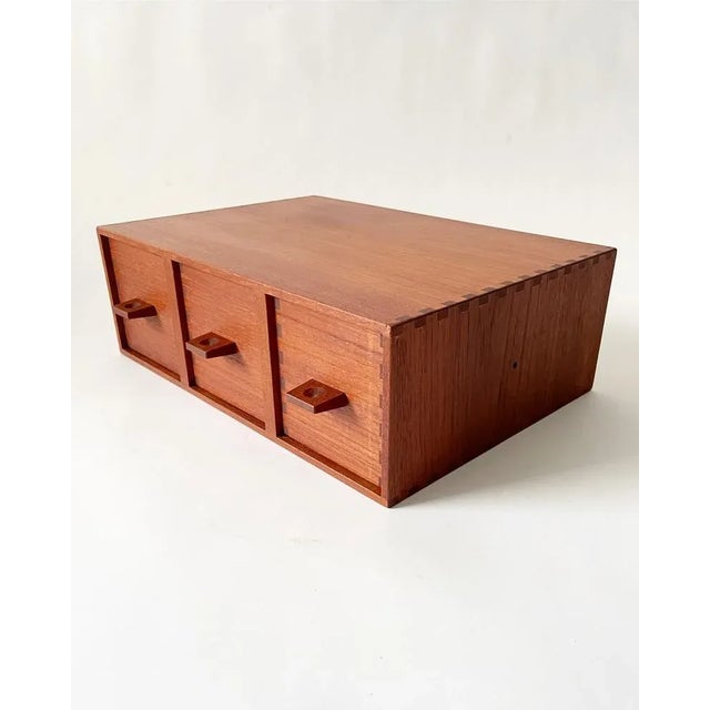 Wall hanged Night table or Chest of drawers in solid teak designed by Östen Kristiansson for Luxus in 1960. The...
