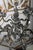 Heavy chandelier made of cast white brass with figural and floral decoration. The chandelier is restored. Restored...