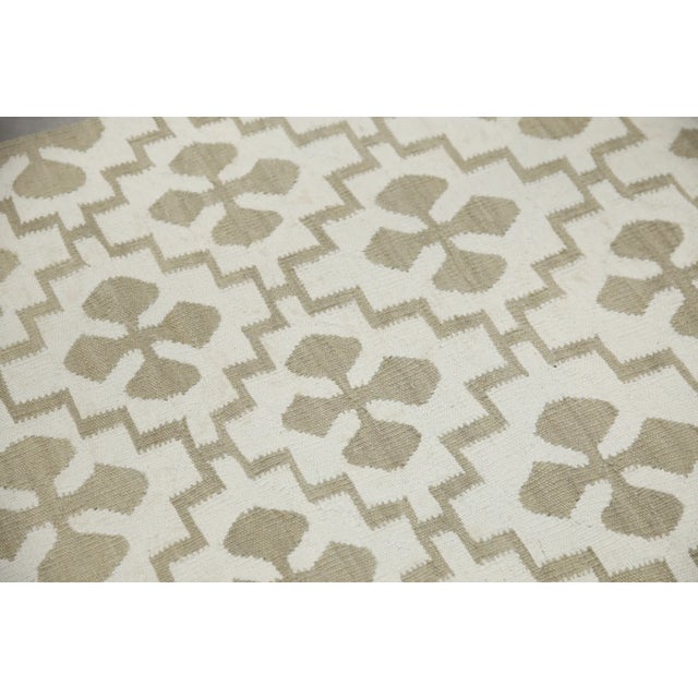 This exquisite Turkish flatweave kilim rug is a stunning masterpiece of traditional craftsmanship. Each rug is...