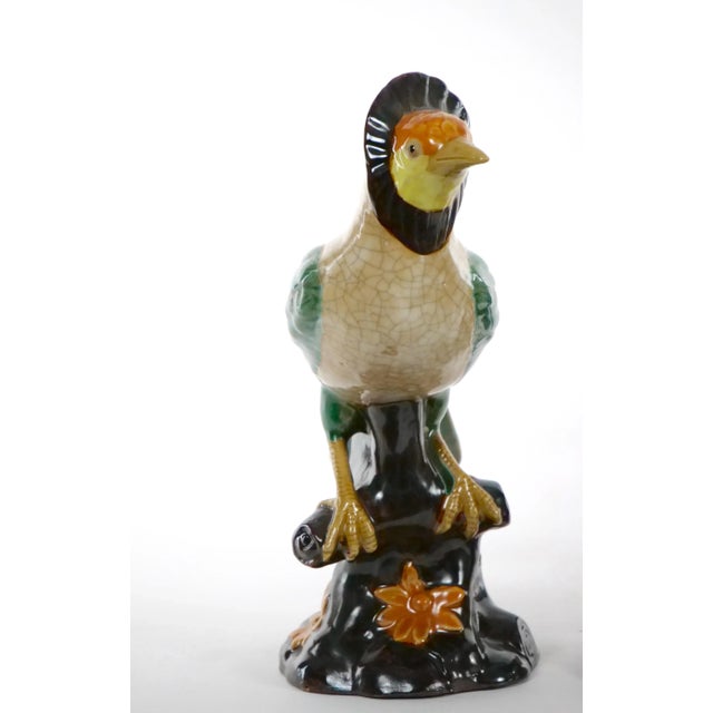 Beautiful English porcelain / terracotta hand painted and glazed decorated pair of decorative tableware bird statues. This...