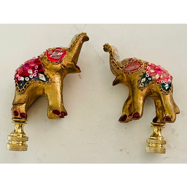 Pair of vintage handmade bejeweled elephant good luck figurines mounted on brass bases as lamp finials.