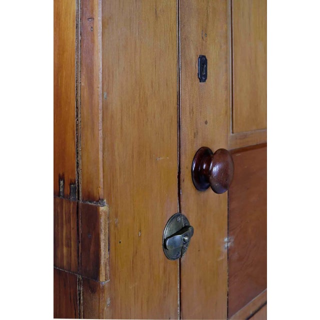 antique early American pine cabinet. Artisan made by cabinet maker using period door with raised panels and brass clasp....