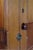 antique early American pine cabinet. Artisan made by cabinet maker using period door with raised panels and brass clasp....